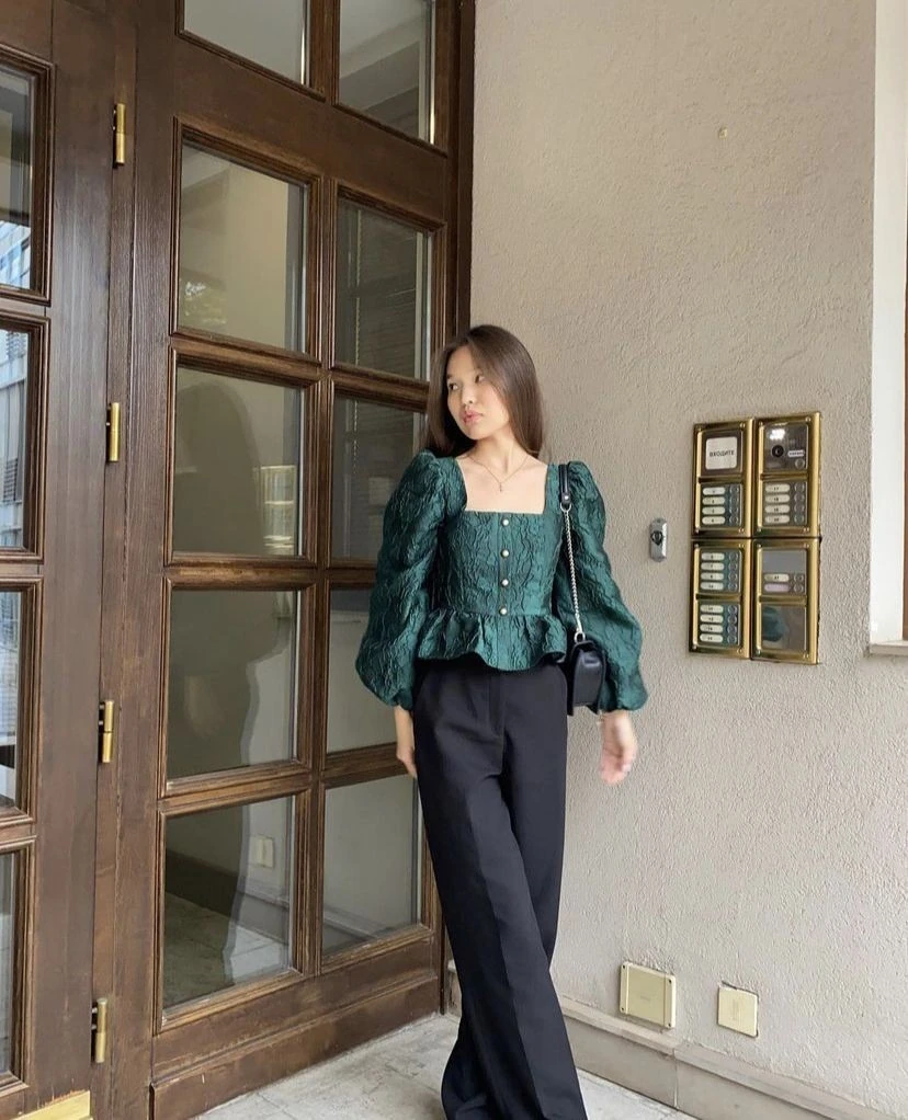 Emerald Peplum Top with Black Trousers