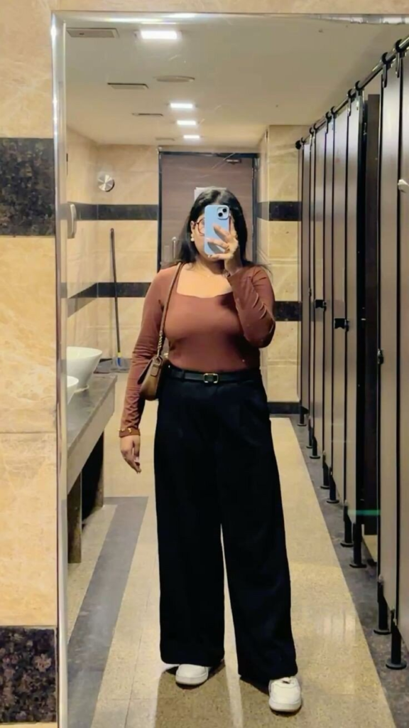 Warm Rust Top with Elegant Black Trousers