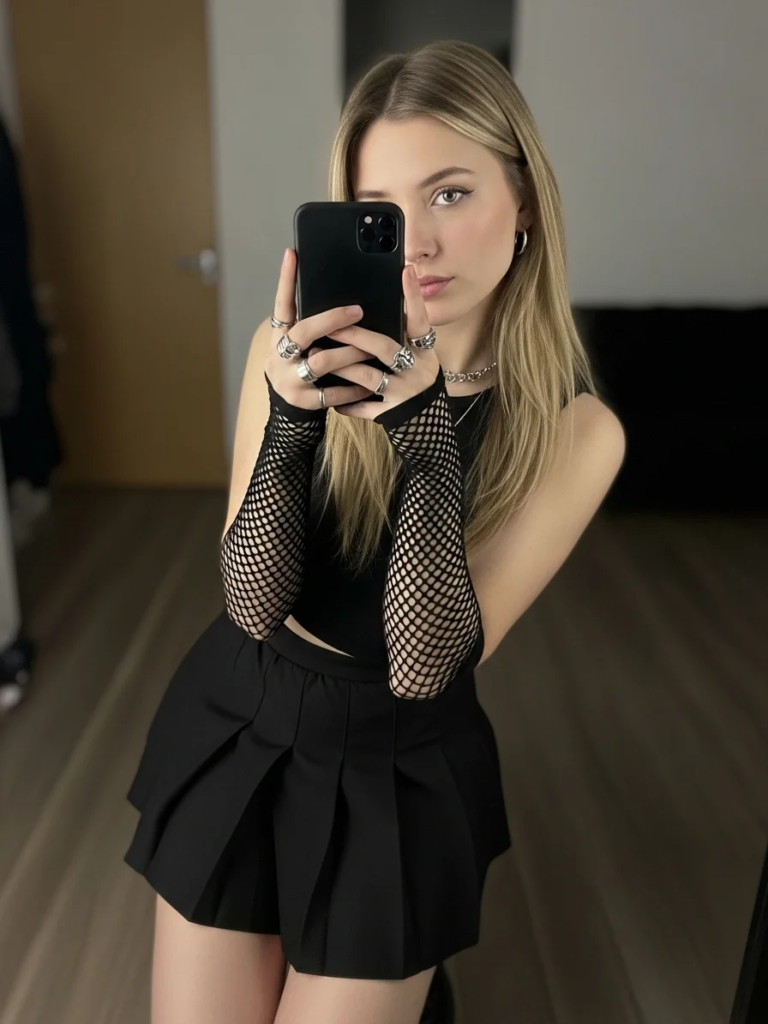 Pleated Black Mini Skirt and Fishnet Arm Warmers